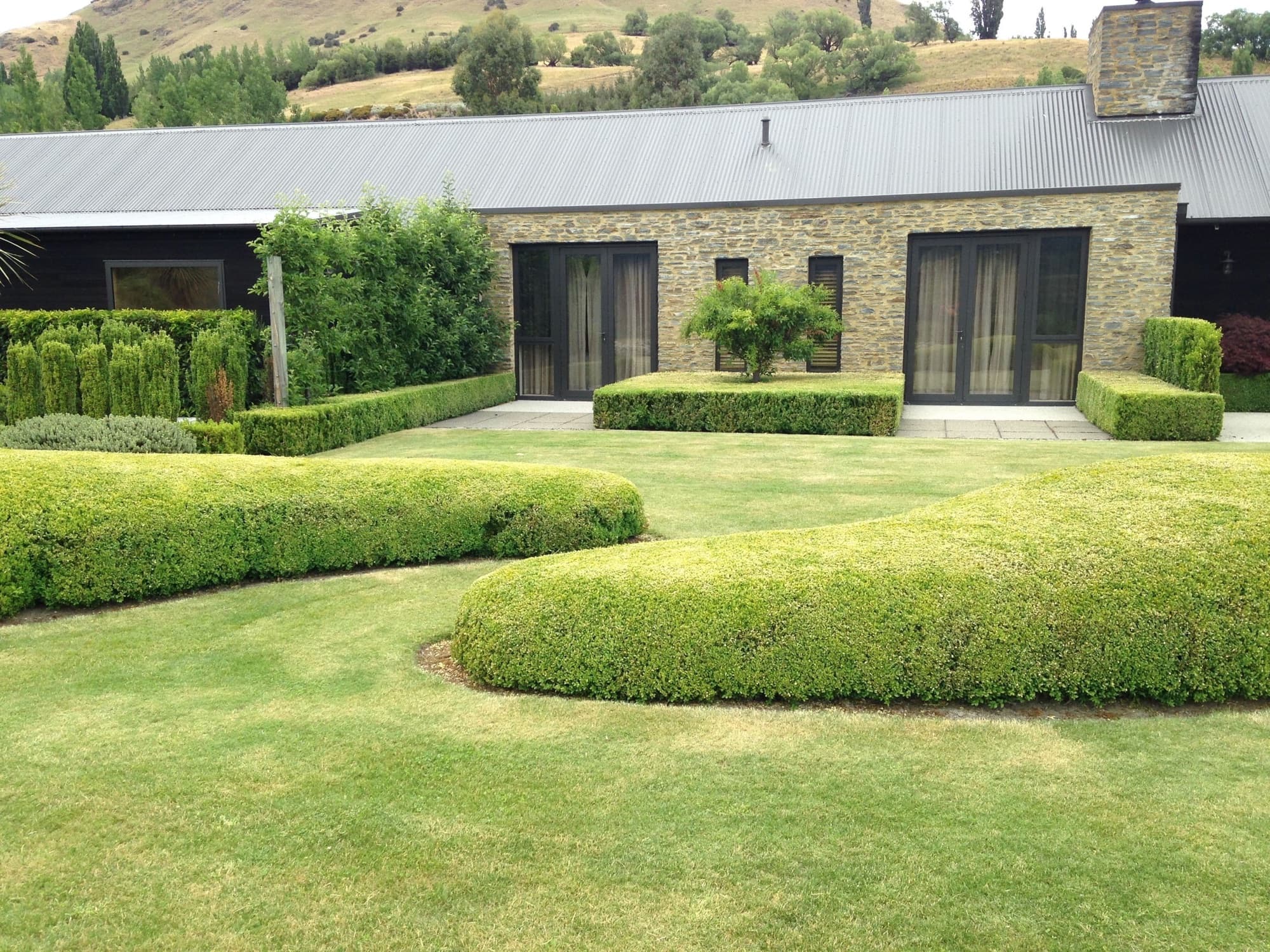 A sculpted, clipped formal garden kept to award standard by Diva